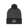 Load image into Gallery viewer, Black and grey Saltbox pom pom beanie laying down