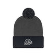 Load image into Gallery viewer, Black and grey Saltbox pom pom beanie laying down