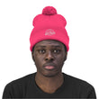 Load image into Gallery viewer, Man with neon pink Saltbox pom pom beanie on head