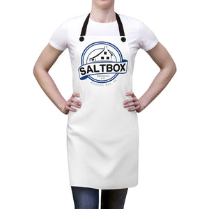 Person wearing white apron with Saltbox Brewing logo on it
