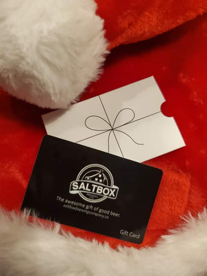Saltbox Brewing Company gift card laying on a Santa hat