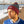 Load image into Gallery viewer, Man with grey and red Saltbox pom pom beanie on head
